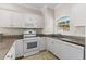 Updated kitchen with granite countertops and white cabinets at 124 South Shore Blvd. # 303, Longs, SC 29568