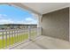 Oversized balcony with gray siding and white railing at 124 South Shore Blvd. # 303, Longs, SC 29568