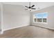 Bright bedroom with ceiling fan and large window at 124 South Shore Blvd. # 303, Longs, SC 29568