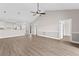 Open living room and kitchen area with hardwood floors and neutral colors at 124 South Shore Blvd. # 303, Longs, SC 29568