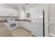 Modern kitchen with white cabinets, granite countertops and stainless steel appliances at 124 South Shore Blvd. # 303, Longs, SC 29568