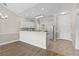 Modern kitchen with white cabinets, granite countertops, and stainless steel appliances at 124 South Shore Blvd. # 303, Longs, SC 29568