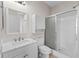 Clean bathroom with white vanity, shower, and toilet at 124 South Shore Blvd. # 303, Longs, SC 29568
