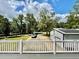 View from deck showcasing backyard, detached garage, and driveway at 6005 Saint Peters Church Rd., Myrtle Beach, SC 29588