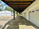 Covered parking area under the house, leading to the garage at 6005 Saint Peters Church Rd., Myrtle Beach, SC 29588