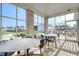 Relaxing screened porch with outdoor seating and community views at 181 Azure Loop, Myrtle Beach, SC 29588