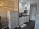Compact kitchen with white cabinets and a wood countertop at 1100 Possum Trot Rd. # F-224, North Myrtle Beach, SC 29582