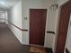 Building hallway with carpet flooring and brown doors at 1100 Possum Trot Rd. # F-224, North Myrtle Beach, SC 29582