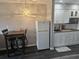 Small kitchen with white cabinets, wood countertop, and modern appliances at 1100 Possum Trot Rd. # F-224, North Myrtle Beach, SC 29582