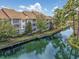 Aerial view of waterfront condo building with parking and a pool at 127 Garden City Connector # 210, Murrells Inlet, SC 29576