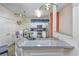 Modern kitchen boasts stainless steel appliances and a large granite island with seating at 127 Garden City Connector # 210, Murrells Inlet, SC 29576