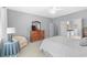 Relaxing bedroom with dresser, seating area, and access to bathroom at 3420 Cedar Creek Run, Little River, SC 29566