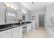 Elegant bathroom with double vanity, soaking tub, and walk-in shower at 3420 Cedar Creek Run, Little River, SC 29566