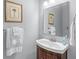Clean bathroom with a dark wood vanity and updated fixtures at 3420 Cedar Creek Run, Little River, SC 29566
