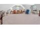 Spacious bonus room with seating area and natural light at 3420 Cedar Creek Run, Little River, SC 29566
