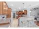 Bright kitchen features hardwood cabinets, stainless steel appliances, and breakfast bar at 3420 Cedar Creek Run, Little River, SC 29566