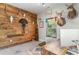 Rustic-style home office features a wood wall, desk, and mounted antlers at 100 Lure Ct., Conway, SC 29526