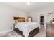 Cozy bedroom with a wooden bed frame, ample closet space, and a cowhide rug at 100 Lure Ct., Conway, SC 29526