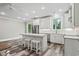 Bright kitchen boasts white cabinets, quartz countertops, and stainless steel appliances at 1612 16Th Ave., Conway, SC 29526