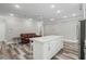 Modern kitchen with a large island, white cabinets and stainless steel appliances at 1612 16Th Ave., Conway, SC 29526