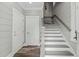 Modern staircase with gray risers and white railing at 1612 16Th Ave., Conway, SC 29526