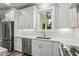 Clean kitchen, featuring white cabinets, stainless steel appliances and quartz countertops at 1612 16Th Ave., Conway, SC 29526