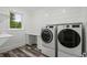 Laundry room with washer, dryer, and built-in shelving at 1612 16Th Ave., Conway, SC 29526