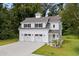 Two-story white barn-style house with double garage at 1612 16Th Ave., Conway, SC 29526