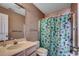 Bathroom with sink, toilet, and tropical shower curtain at 4103 Pinehurst Circle # Bb-11, Little River, SC 29566