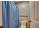 Simple bathroom with shower and blue curtain at 4103 Pinehurst Circle # Bb-11, Little River, SC 29566