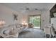Spacious living room with a sofa, chairs and access to a balcony at 4103 Pinehurst Circle # Bb-11, Little River, SC 29566