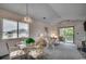 Bright dining area with glass-top table and four ornate chairs at 4103 Pinehurst Circle # Bb-11, Little River, SC 29566