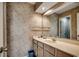 Clean bathroom with sink, vanity, and patterned wallpaper at 4103 Pinehurst Circle # Bb-11, Little River, SC 29566