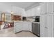 Bright kitchen, featuring white cabinets and stainless steel appliances at 251 Galapagos Dr., Little River, SC 29566