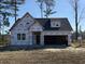 Newly constructed home with a two-car garage and wrap-around porch at 116 Infinity Ln., Loris, SC 29569