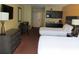 Two double beds, kitchenette, and dresser at 1501 S Ocean Blvd. # 429, Myrtle Beach, SC 29577