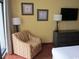 Comfortable bedroom with armchair and dresser, offering a relaxing space at 1501 S Ocean Blvd. # 429, Myrtle Beach, SC 29577
