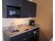 Small kitchenette with granite countertop and microwave at 1501 S Ocean Blvd. # 429, Myrtle Beach, SC 29577