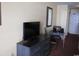 Dresser, small dining table, and wall-mounted TV at 1501 S Ocean Blvd. # 429, Myrtle Beach, SC 29577