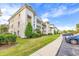 Well-maintained building with ample parking and landscaping at 624 River Oaks Dr. # 52G, Myrtle Beach, SC 29579