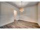 Dining area with hardwood floors and a woven light fixture at 1021 Brick Point Ct., Conway, SC 29526