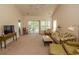 Spacious living room with high ceilings and a view to the kitchen at 5810 Longwood Dr. # 14-304, Murrells Inlet, SC 29576