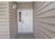Inviting condo entry with a white door and sidelight at 5810 Longwood Dr. # 14-304, Murrells Inlet, SC 29576