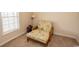 Relaxing reading nook with comfortable chair and natural light at 5810 Longwood Dr. # 14-304, Murrells Inlet, SC 29576