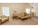 Bright living room with vaulted ceiling, comfortable seating area, and adjacent dining space at 5810 Longwood Dr. # 14-304, Murrells Inlet, SC 29576