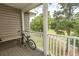 Screened balcony overlooks a lush golf course and trees at 5810 Longwood Dr. # 14-304, Murrells Inlet, SC 29576
