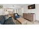Living room with sofa, armchair, and view into kitchen at 5308 N Ocean Blvd. # 715, Myrtle Beach, SC 29577