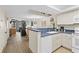 Kitchen with white cabinets and blue countertops at 5308 N Ocean Blvd. # 715, Myrtle Beach, SC 29577