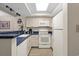 Well-equipped kitchen with white appliances and blue countertops at 5308 N Ocean Blvd. # 715, Myrtle Beach, SC 29577