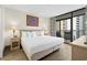 King-size bed in main bedroom with balcony access at 5308 N Ocean Blvd. # 715, Myrtle Beach, SC 29577